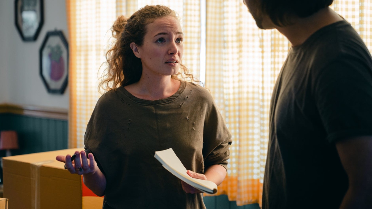 couple talking while moving in new apartment