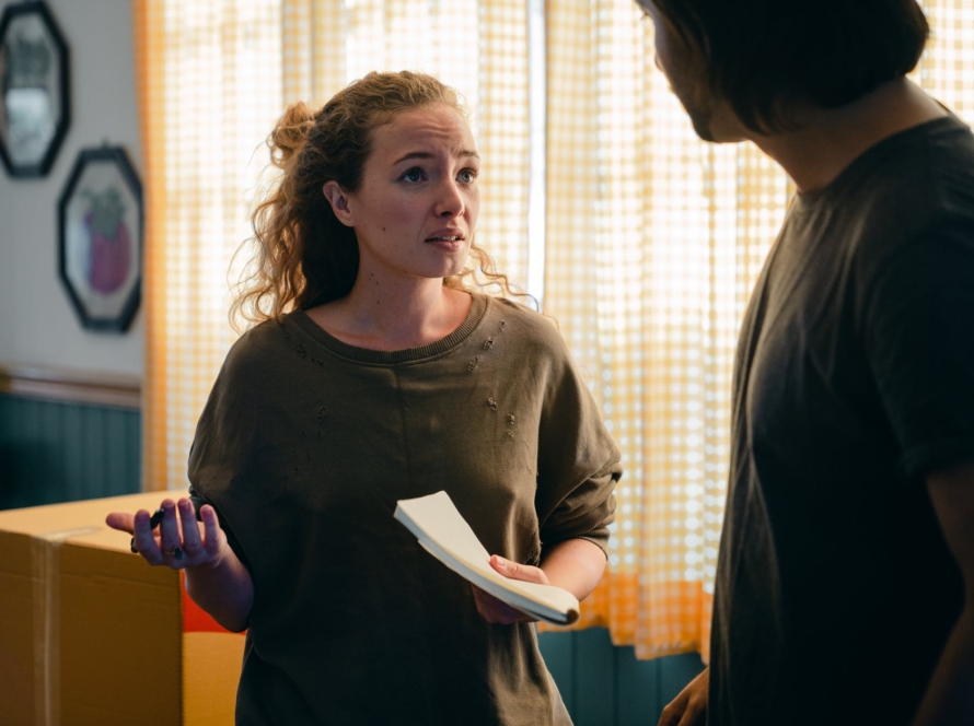 couple talking while moving in new apartment