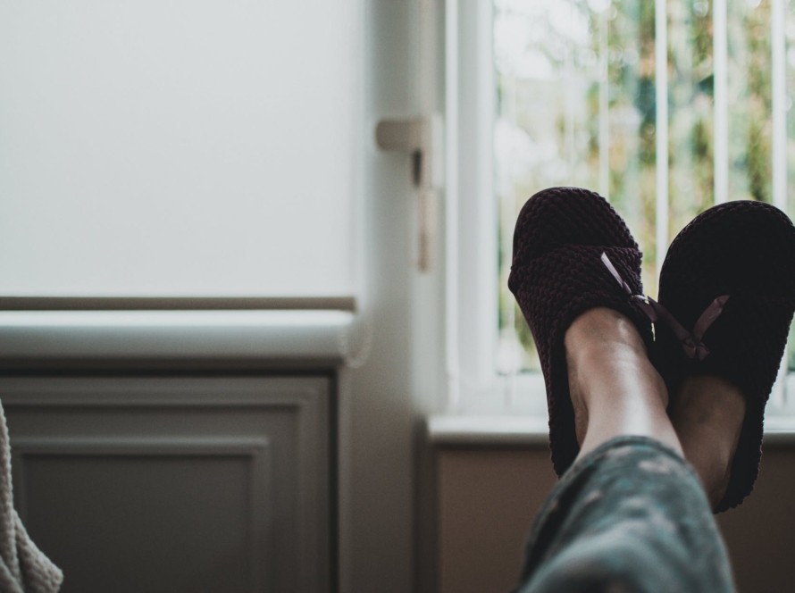 person wearing pair of black slides